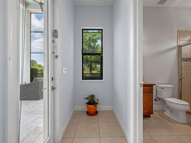 4071 Isabella Cir, Windermere, FL 34786 - doorway featuring light tile patterned floors and baseboards