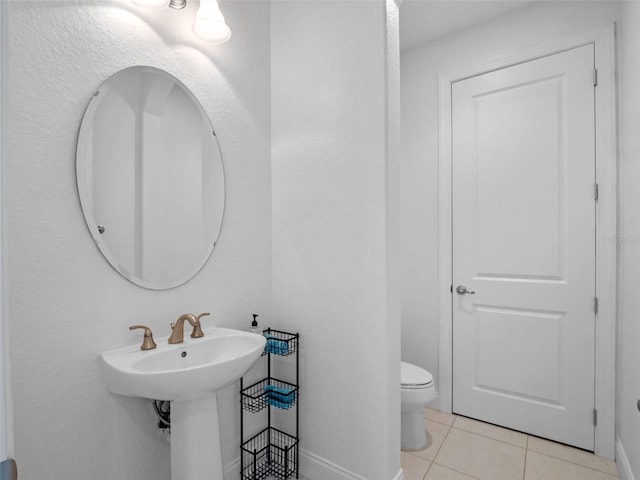 4071 Isabella Cir, Windermere, FL 34786 - half bathroom featuring tile patterned floors, baseboards, and toilet