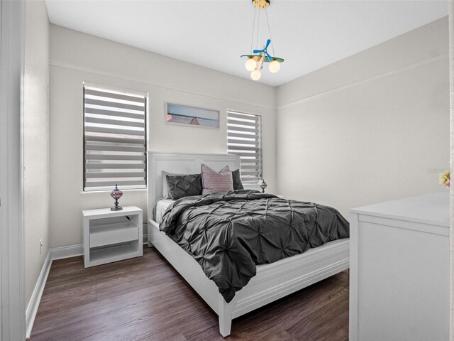 4071 Isabella Cir, Windermere, FL 34786 - bedroom featuring wood finished floors and baseboards