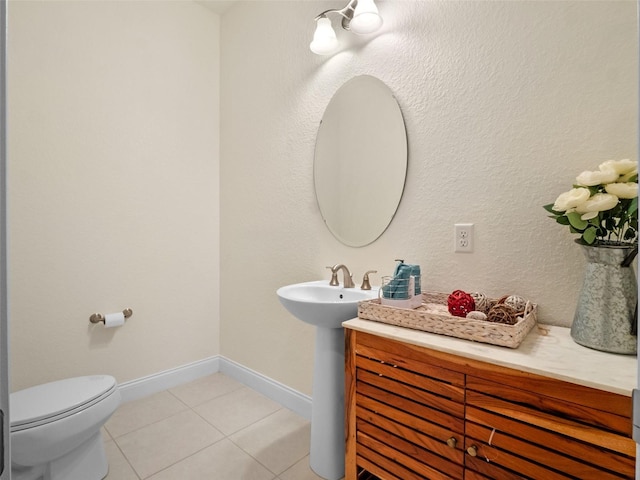 4071 Isabella Cir, Windermere, FL 34786 - bathroom with tile patterned floors, toilet, baseboards, and a sink