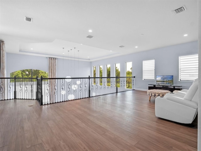 4071 Isabella Cir, Windermere, FL 34786 - living room with a tray ceiling, wood finished floors, recessed lighting, and baseboards