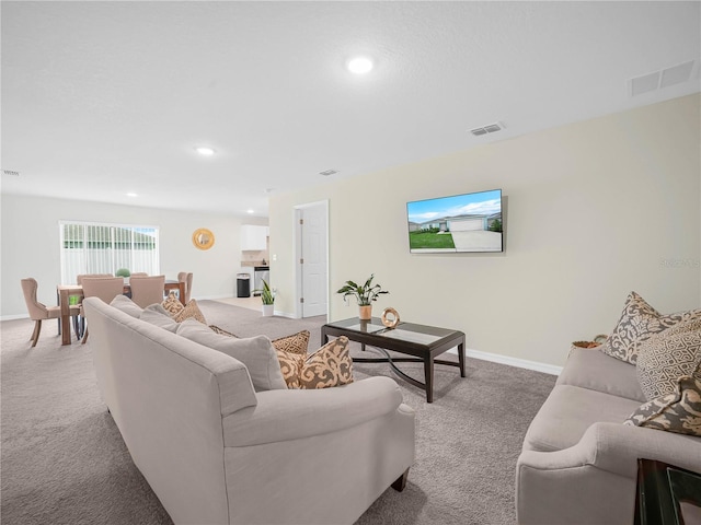 440 Patricia Alford Dr, Haines City, FL 33844 - living area featuring carpet, recessed lighting, and baseboards