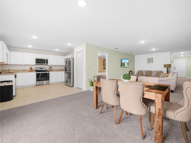 440 Patricia Alford Dr, Haines City, FL 33844 - dining room with recessed lighting and light carpet