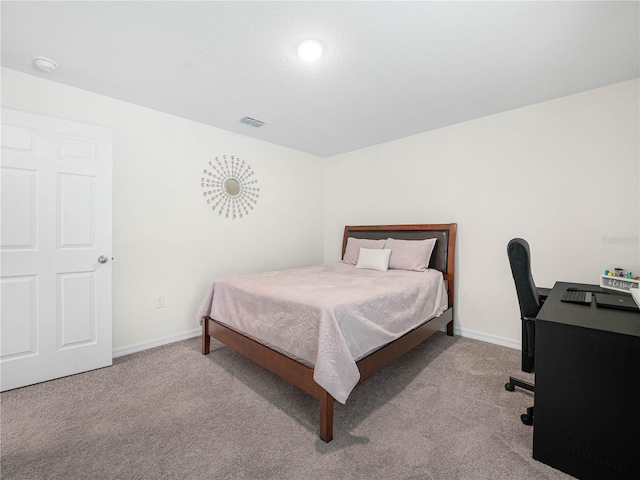 440 Patricia Alford Dr, Haines City, FL 33844 - carpeted bedroom with baseboards and a desk