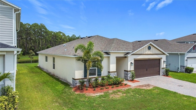 2836 Sanctuary Dr, Clermont, FL 34714 - view of front of home with a front lawn, roof with shingles, a garage, and decorative driveway