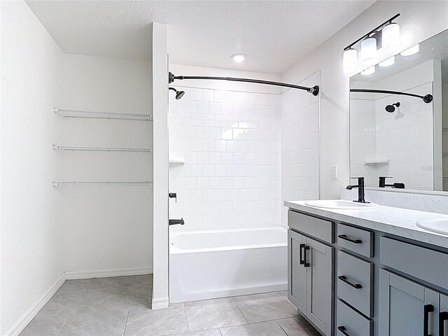 2836 Sanctuary Dr, Clermont, FL 34714 - bathroom with tub / shower combination, double vanity, tile patterned flooring, baseboards, and a textured ceiling