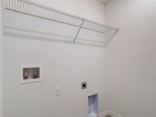 2836 Sanctuary Dr, Clermont, FL 34714 - washroom with electric dryer hookup, hookup for a washing machine, and baseboards
