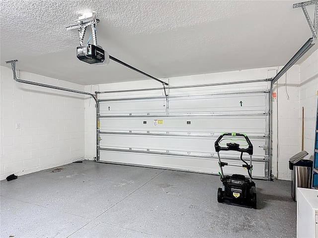 2836 Sanctuary Dr, Clermont, FL 34714 - garage featuring a garage door opener and concrete block wall