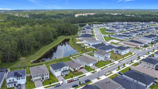 2836 Sanctuary Dr, Clermont, FL 34714 - aerial view of residential area featuring a heavily wooded area and a nearby body of water