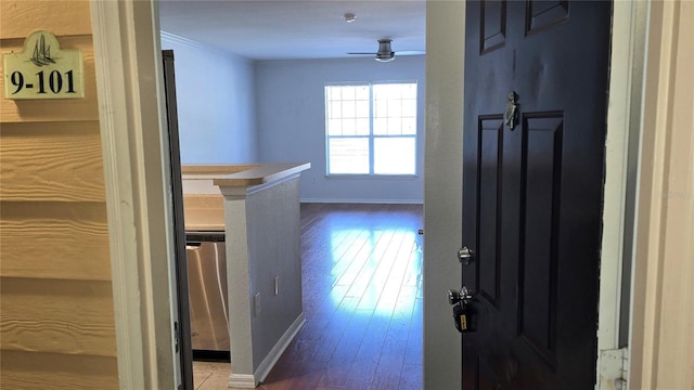 5000 Culbreath Key Way Unit 9-101, Tampa, FL 33611 - corridor with baseboards, ornamental molding, and hardwood / wood-style floors