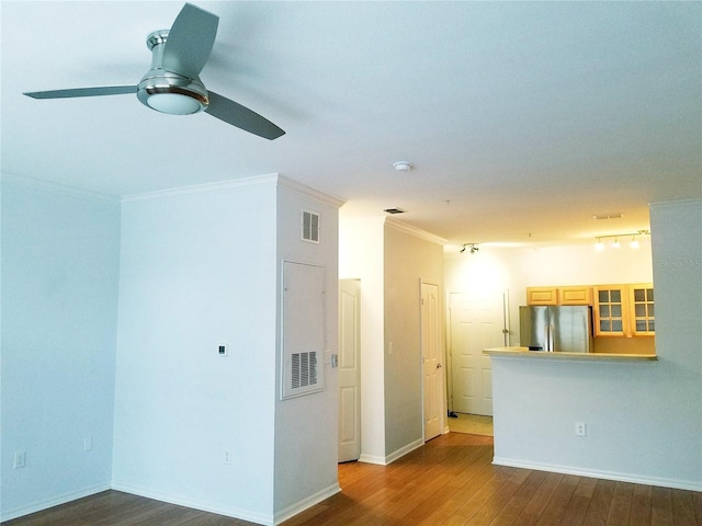 5000 Culbreath Key Way Unit 9-101, Tampa, FL 33611 - spare room with a ceiling fan, wood finished floors, ornamental molding, and baseboards