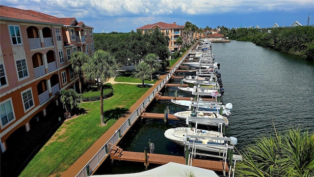 5000 Culbreath Key Way Unit 9-101, Tampa, FL 33611 - dock area with boat lift, a water view, and a lawn