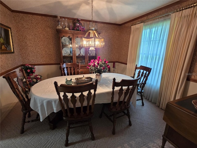 579 Rockingham Rd, Orange Park, FL 32073 - dining room with wallpapered walls, ornamental molding, a chandelier, and carpet