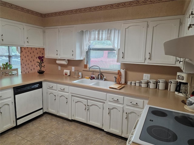 579 Rockingham Rd, Orange Park, FL 32073 - kitchen featuring white appliances, a sink, white cabinets, light countertops, and light tile patterned flooring