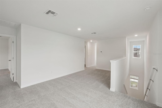 1855 Brekey Way, Zephyrhills, FL 33541 - carpeted empty room featuring recessed lighting and a smoke detector