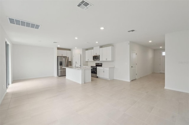 1855 Brekey Way, Zephyrhills, FL 33541 - unfurnished living room with a sink and recessed lighting