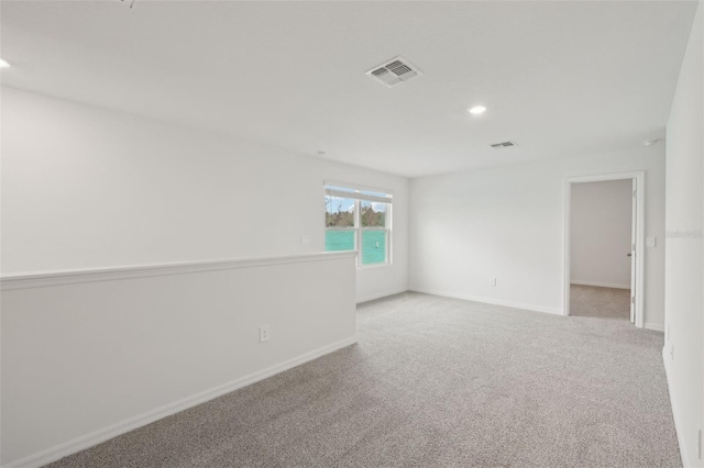 1855 Brekey Way, Zephyrhills, FL 33541 - empty room with carpet floors and recessed lighting