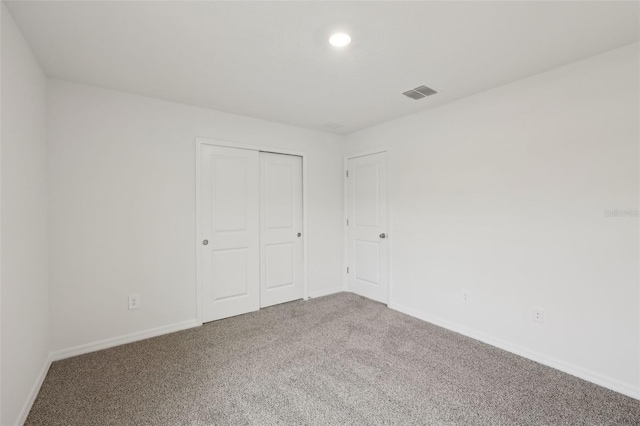 1855 Brekey Way, Zephyrhills, FL 33541 - unfurnished bedroom with carpet, recessed lighting, and a closet