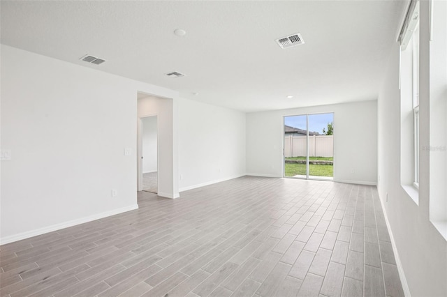 1828 Brekey Way, Zephyrhills, FL 33541 - spare room featuring wood finished floors