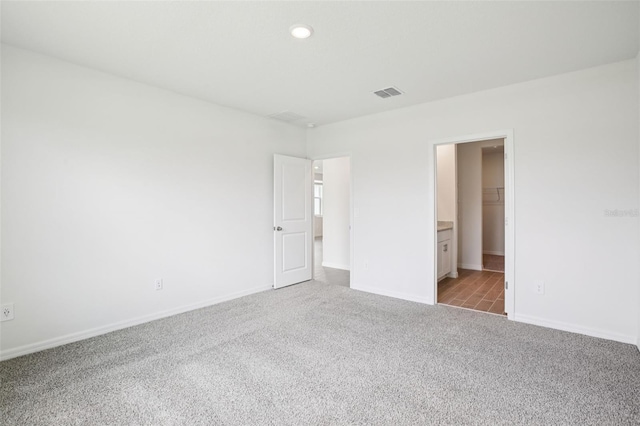 1828 Brekey Way, Zephyrhills, FL 33541 - unfurnished bedroom featuring carpet and recessed lighting