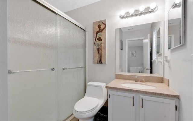 9616 River Walk Ct, Orlando, FL 32825 - bathroom featuring toilet, vanity, and a shower stall