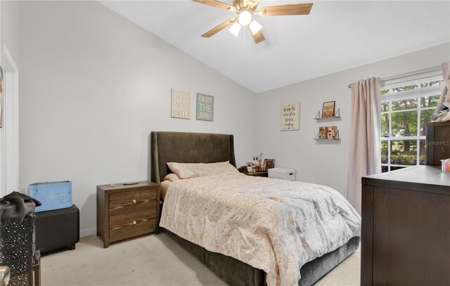9616 River Walk Ct, Orlando, FL 32825 - bedroom featuring light colored carpet, lofted ceiling, and ceiling fan