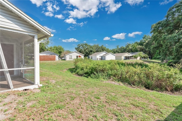 9616 River Walk Ct, Orlando, FL 32825 - view of green lawn featuring a sunroom