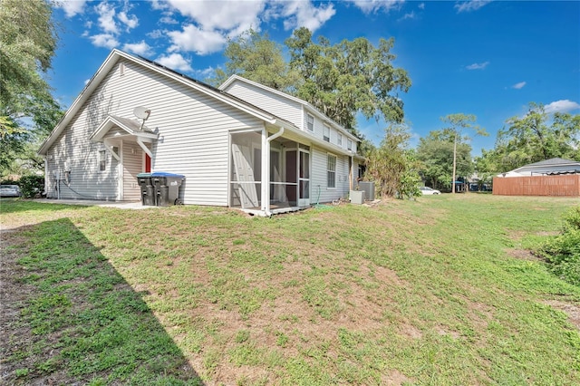 9616 River Walk Ct, Orlando, FL 32825 - rear view of property featuring a sunroom
