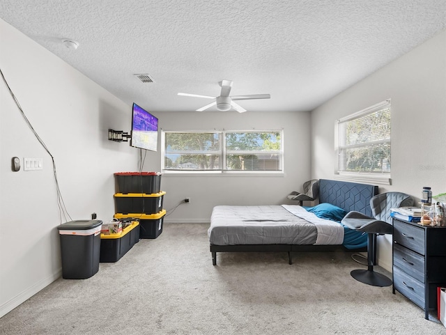 4546 Malibu St, Orlando, FL 32811 - carpeted bedroom with baseboards, a textured ceiling, and a ceiling fan