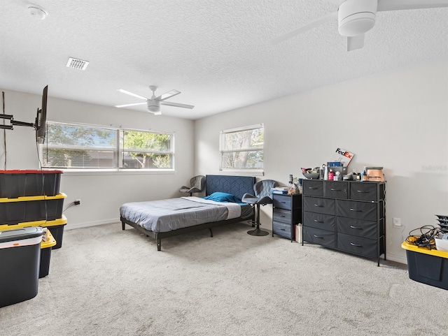 4546 Malibu St, Orlando, FL 32811 - bedroom with carpet, a ceiling fan, a textured ceiling, and baseboards