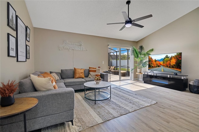 2406 Placid Way, Kissimmee, FL 34758 - living room featuring wood finished floors, a ceiling fan, and vaulted ceiling