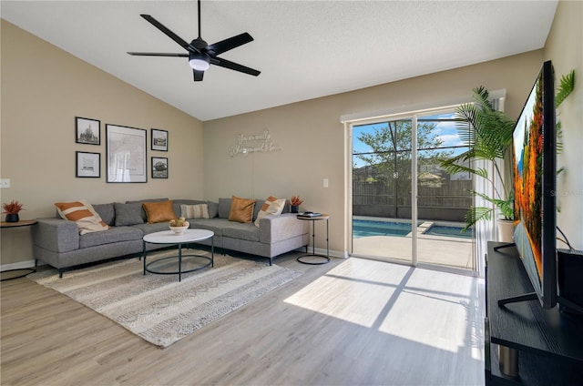 2406 Placid Way, Kissimmee, FL 34758 - living area with wood finished floors, lofted ceiling, a ceiling fan, and baseboards