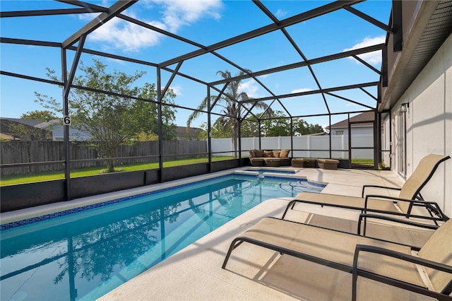 2406 Placid Way, Kissimmee, FL 34758 - view of swimming pool featuring a patio, a fenced backyard, outdoor lounge area, and a lanai