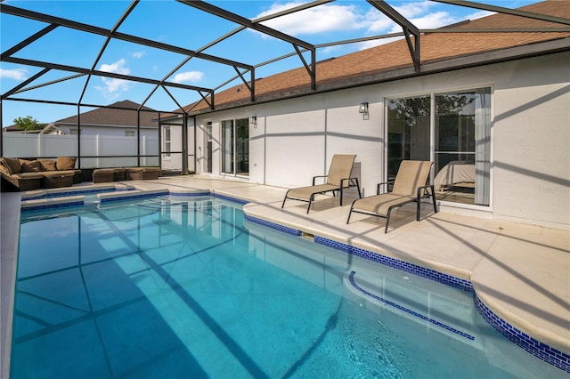 2406 Placid Way, Kissimmee, FL 34758 - view of pool with an outdoor hangout area, a patio area, a pool with connected hot tub, and a lanai