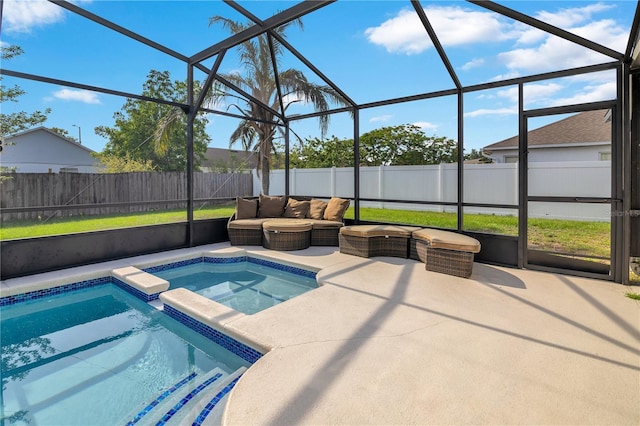 2406 Placid Way, Kissimmee, FL 34758 - view of swimming pool with a fenced backyard, a patio area, glass enclosure, a pool with connected hot tub, and an outdoor living space
