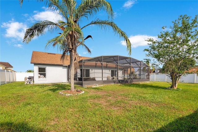 2406 Placid Way, Kissimmee, FL 34758 - rear view of property featuring glass enclosure and stucco siding