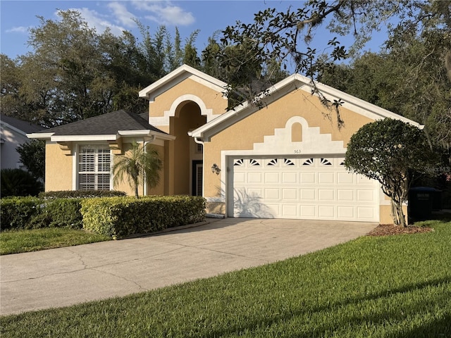 563 Pleasant Grove Dr, Winter Springs, FL 32708 - view of front of house featuring a garage, concrete driveway, stucco siding, and a front yard