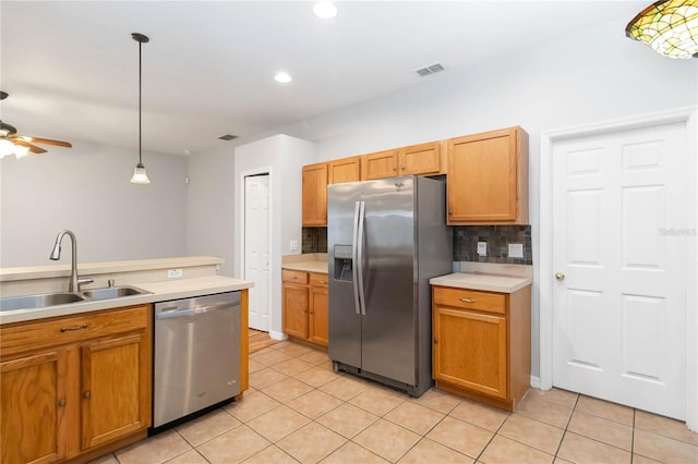 2280 Yorville Ct, Ocoee, FL 34761 - kitchen with appliances with stainless steel finishes, light tile patterned floors, decorative backsplash, light countertops, and recessed lighting