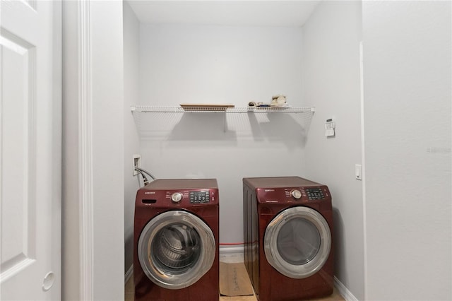 2280 Yorville Ct, Ocoee, FL 34761 - laundry room featuring separate washer and dryer and baseboards