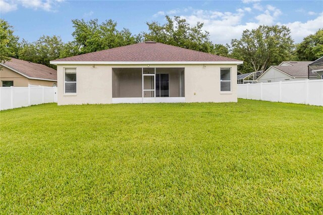 2280 Yorville Ct, Ocoee, FL 34761 - rear view of property featuring stucco siding, a sunroom, and a shingled roof