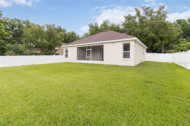 2280 Yorville Ct, Ocoee, FL 34761 - back of house featuring stucco siding and a fenced backyard