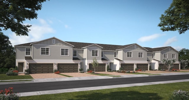 2521 Starry Pt, Saint Cloud, FL 34769 - view of front of home with an attached garage, board and batten siding, driveway, and stone siding
