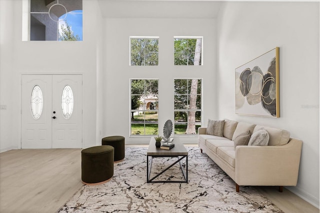 14927 Faversham Cir, Orlando, FL 32826 - living room with a high ceiling, healthy amount of natural light, and wood finished floors