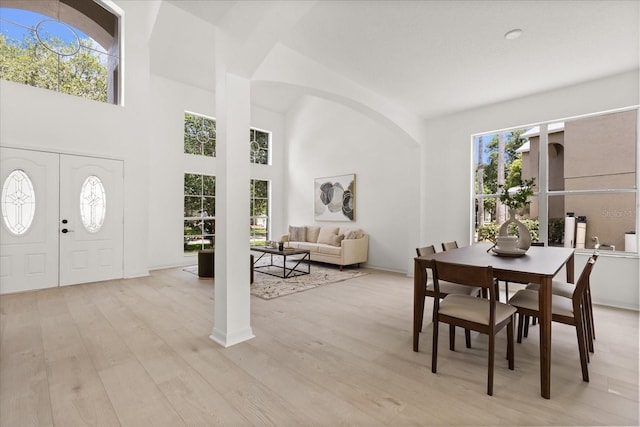 14927 Faversham Cir, Orlando, FL 32826 - foyer featuring light wood-style floors and a towering ceiling