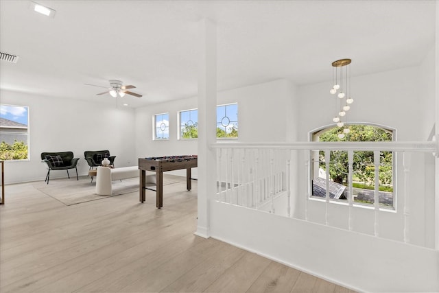 14927 Faversham Cir, Orlando, FL 32826 - hallway featuring wood finished floors and baseboards