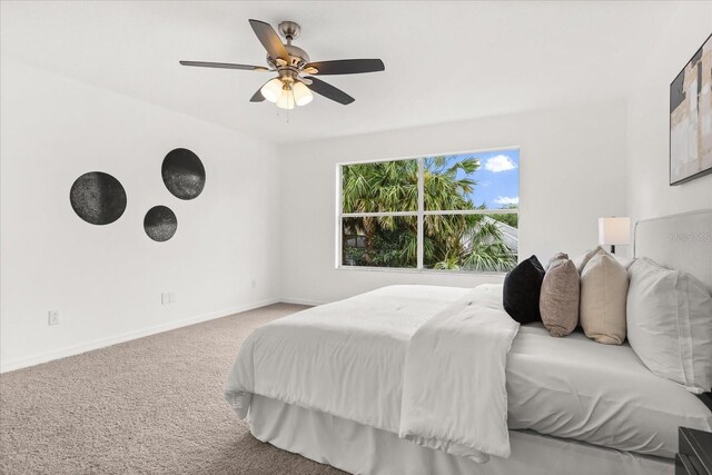 14927 Faversham Cir, Orlando, FL 32826 - bedroom featuring carpet, baseboards, and ceiling fan