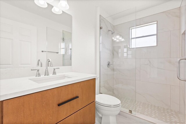 14927 Faversham Cir, Orlando, FL 32826 - full bathroom featuring toilet, a marble finish shower, and vanity