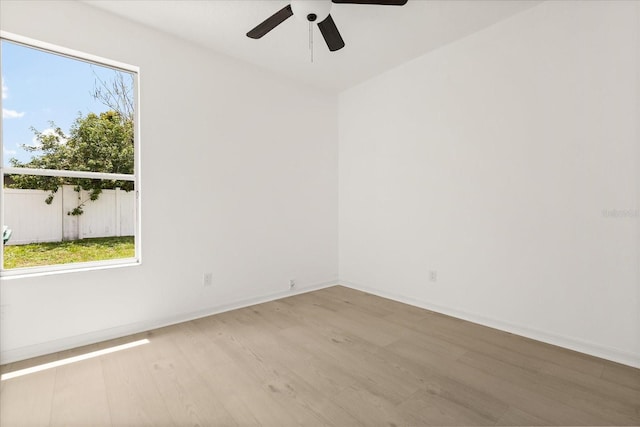 14927 Faversham Cir, Orlando, FL 32826 - spare room with wood finished floors, a ceiling fan, plenty of natural light, and baseboards