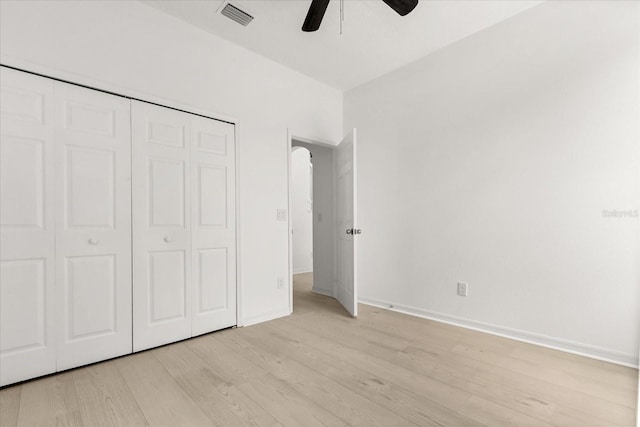 14927 Faversham Cir, Orlando, FL 32826 - unfurnished bedroom with light wood-style flooring, a closet, baseboards, and ceiling fan