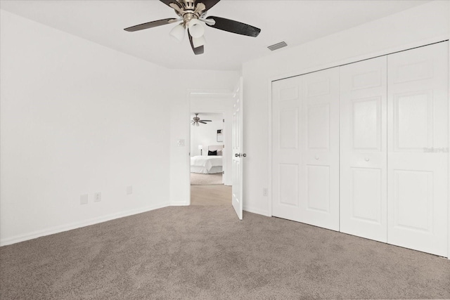 14927 Faversham Cir, Orlando, FL 32826 - unfurnished bedroom featuring carpet, a closet, baseboards, and ceiling fan